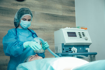 Professional anesthesiologist putting her patient under narcosis