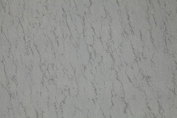 Metallic wall background, texture in gray color on the old bizarre surface. Abstract pattern on a faded metal surface. Abstract sketches and colors of old walls and fences. Natural stylish surface