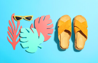 Composition with beach accessories on color background