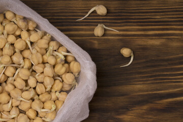 Germinated chickpeas on wooden background