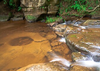 Falling Foss waterfall & May Beck, flowing stream through rocks