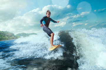 Surfer on Blue Ocean Wave Getting Barreled.  © Artur Didyk