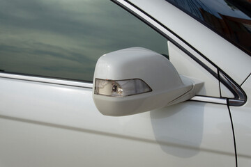 broken signal light on a car side mirror from  traffic accident