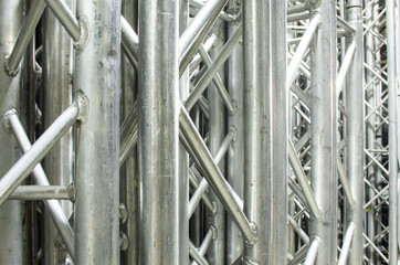 Stack of rigging steel trusses for stage building and installation of professional constructions.