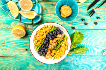 Healthy food concept, Diet salad plate. Fresh salad recipe. Grilled chicken fillet, fresh vegetable cotn salad and blueberries
