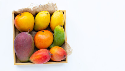 Tropical fruit, Mango in wooden box on white background.