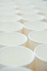 Coffee paper cups in a row. Background coffee to go.
