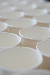 Obraz na płótnie Canvas Coffee paper cups in a row. Background coffee to go.