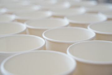 Coffee paper cups in a row. Background coffee to go.
