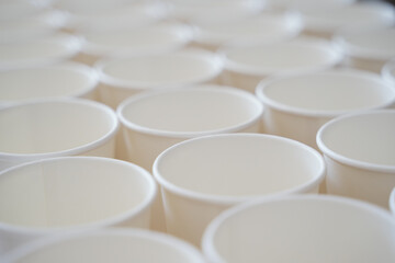 Coffee paper cups in a row. Background coffee to go.