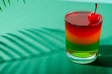 Tasty, sweet three-layer tropical jelly with cherries.