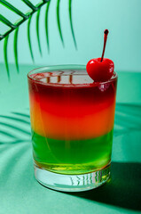 Tasty, sweet three-layer tropical jelly with cherries.