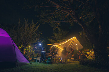 Tent in the forest, Group friends camping tent together. - obrazy, fototapety, plakaty