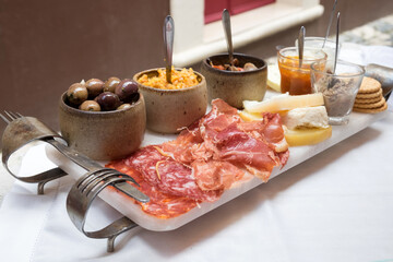 Portuguese tapas - smoked ham, salami, chorizo sausages, a variety of cheese, crackers, liver pate and several traditional kinds of jam