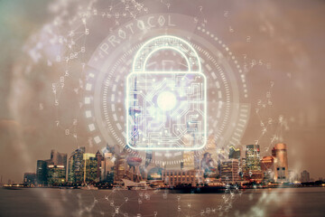 Lock icon hologram on city view with skyscrapers background multi exposure. Data security concept.