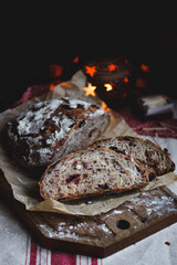 Sliced ​​bread with cranberries and nuts on the table