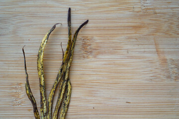 change of color leaves on rustic wooden background. Climate change concept