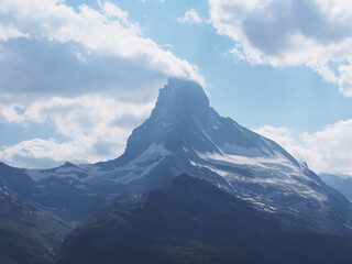 Matterhorn seen from the mountain climbed by the train in Zermatt on a sunny day.