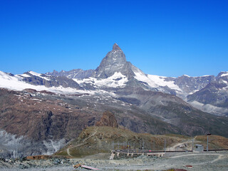 Matterhorn seen from the mountain climbed by the train in Zermatt on a sunny day.
