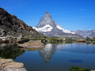 Matterhorn seen from the mountain climbed by the train in Zermatt on a sunny day.