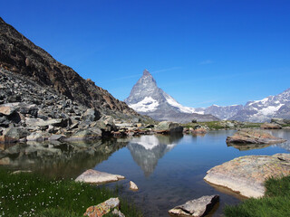 Matterhorn seen from the mountain climbed by the train in Zermatt on a sunny day.