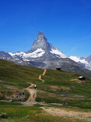 Matterhorn seen from the mountain climbed by the train in Zermatt on a sunny day.