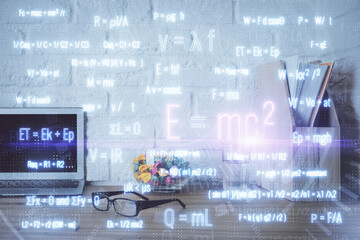 Desktop computer background and formula hologram writing. Double exposure. Education concept.
