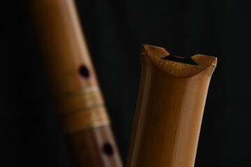 Shakuhachi flute, Shakuhachi is Japanese bamboo flute, on black background. © makoto photo
