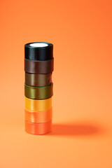 colored packing tape in rolls on colored background