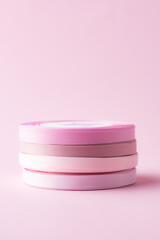 colored packing tape in rolls on colored background