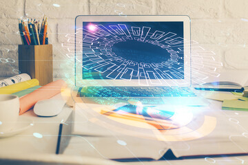 Multi exposure of desktop computer and technology theme hologram. Concept of software development.