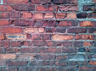 A wall of old red brick