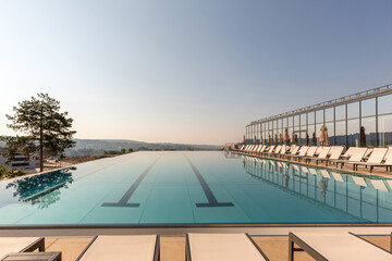 Fototapeta na wymiar Outdoor swimming pool in a modern hotel