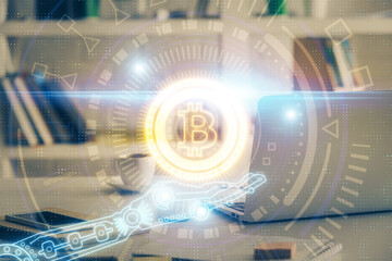 Multi exposure of blockchain theme hologram and table with computer background. Concept of bitcoin...