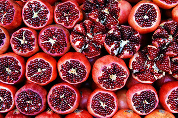 Many pomegranate fruits on the market. Trading seasonal fruits in the store