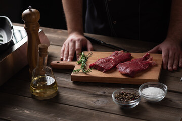 the chef is about to marinate the beef steak