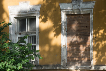 Abandoned house. Windows boarded up with boards. The architectural monument is in need of repair or...