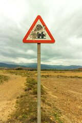 traffic signs near a railroad crossing