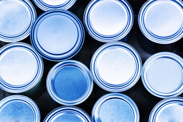A lot of metal paint cans. View from above. Close-up