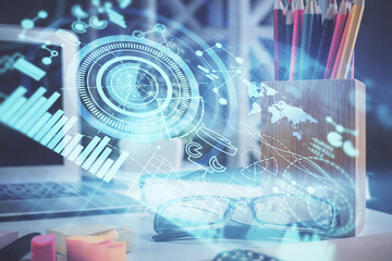 Business theme hologram with glasses on the table background. Concept of search. Double exposure.