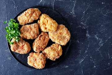 Japanese pork cutlets, HireKatsu on a black plate