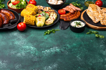 Grilled sausages, meat, and vegetables.