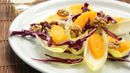 Salad with endive, red cabbage and orange