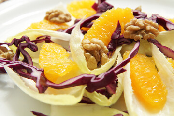 Salad with endive, red cabbage and orange