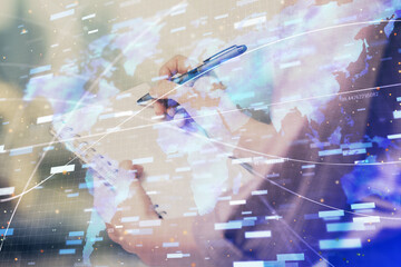 Fototapeta na wymiar Multi exposure of woman's writing hand on background with data technology hud. Concept of innovation.