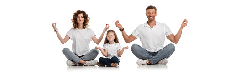 horizontal crop of happy family sitting in yoga pose on white