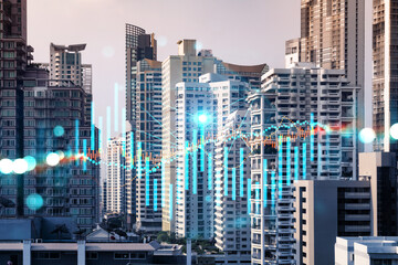 Obraz na płótnie Canvas Forex and stock market chart hologram over panorama city view of Bangkok, the financial center in Asia. The concept of international trading. Double exposure.