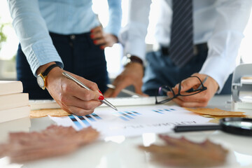 Businessman and businesswoman in office analyze autumn plan. Business research in business concept