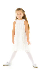 Naklejka premium Little girl in an elegant dress.The concept of a happy childhood