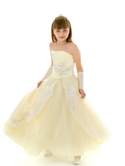 Fototapeta na wymiar A little girl in a long, elegant dress of a princess.